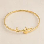 Top view customized gold name kada with personalized script and heart