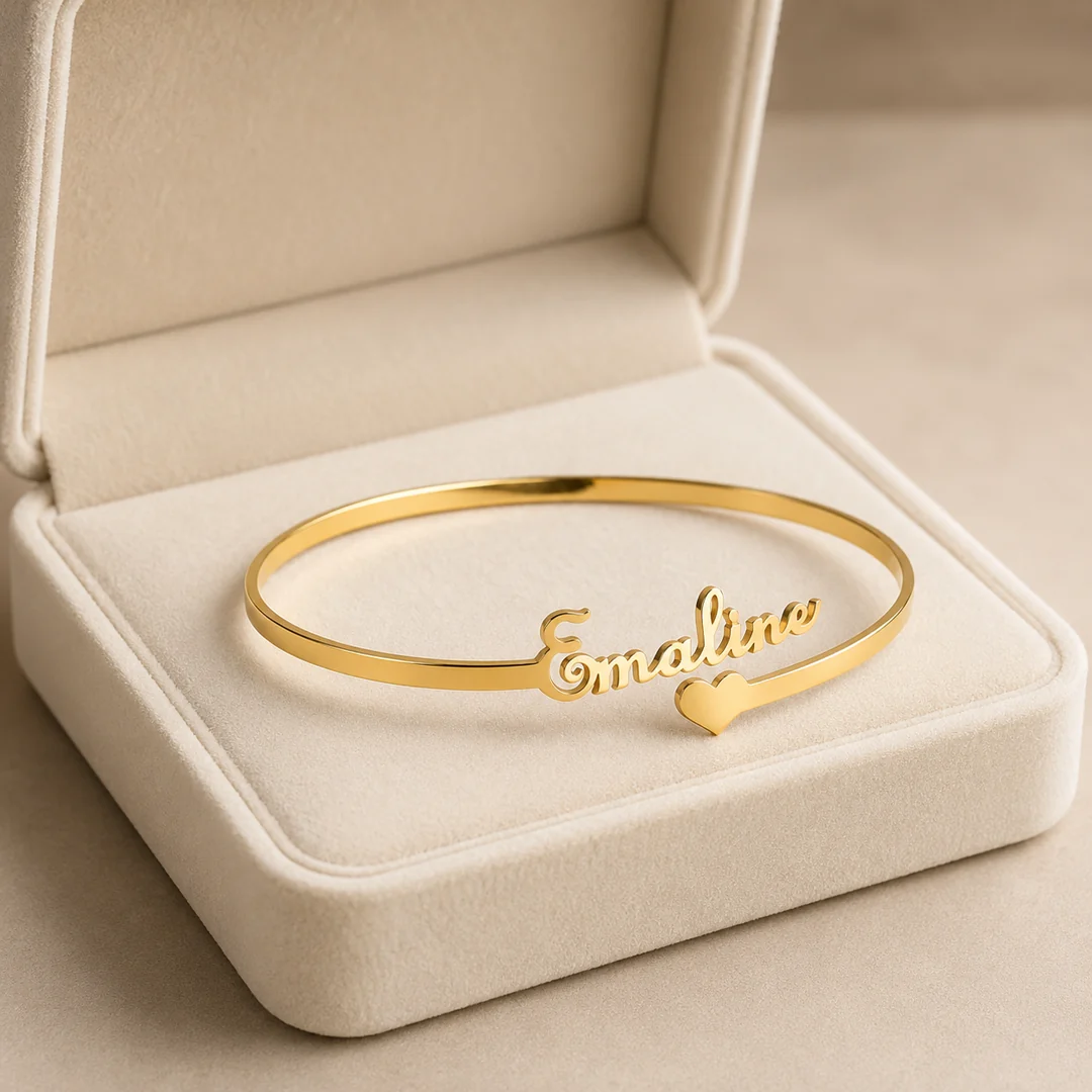 Customized gold name kada bracelet displayed in a cream gift box