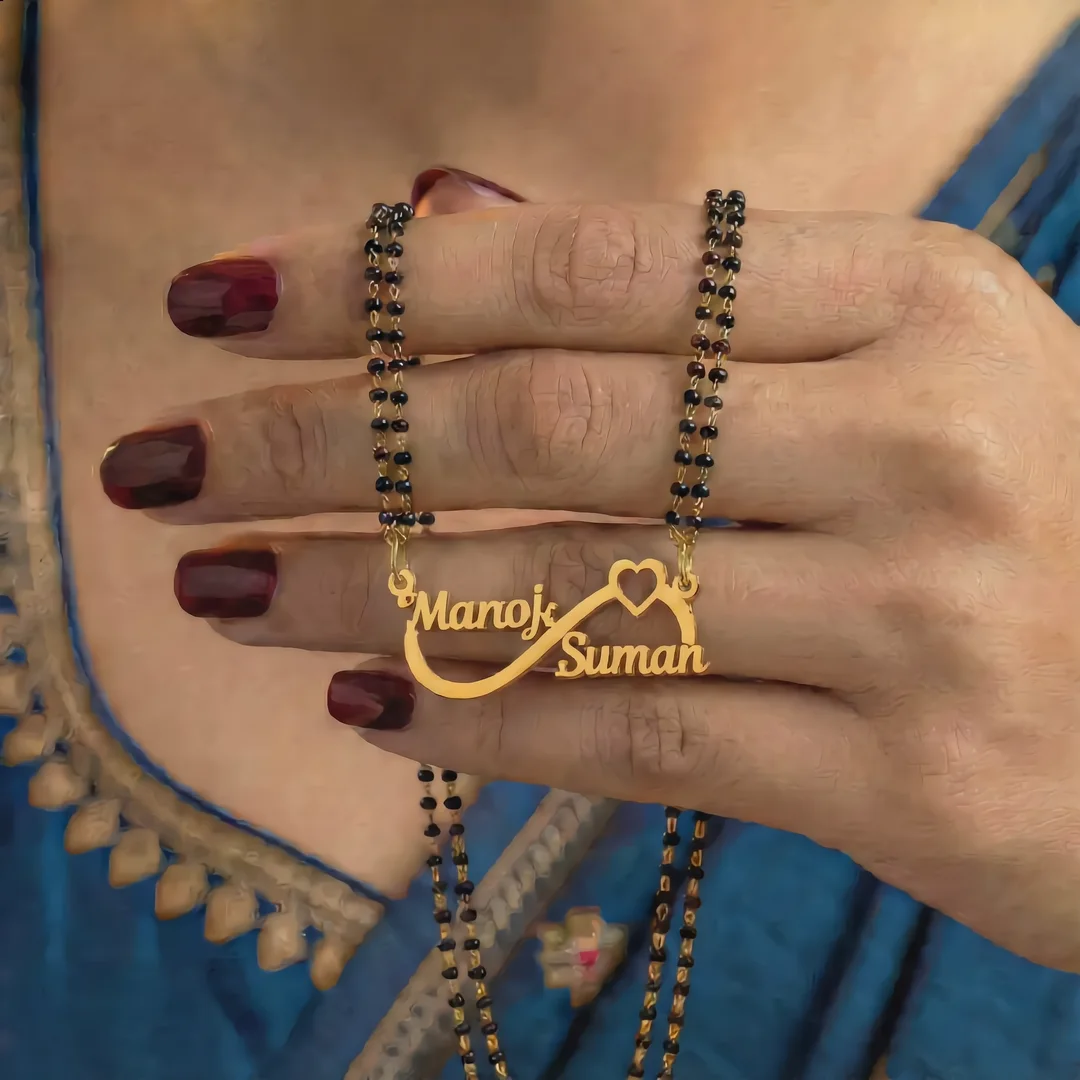 Infinity Double Name Mangalsutra with exact Manoj and Suman names draped over a female hand