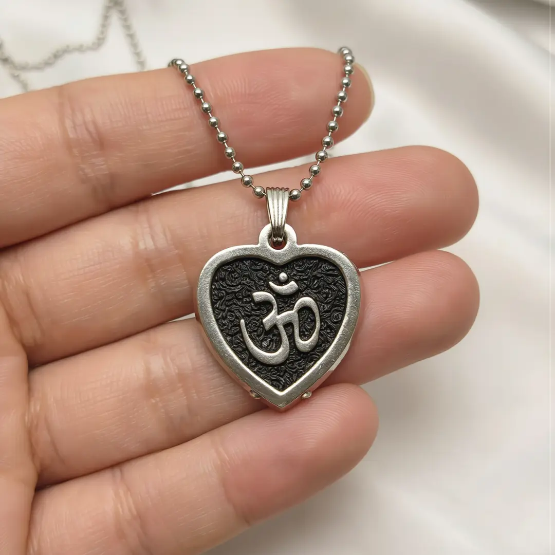 Black Om Heart Pendant hand-held detail view