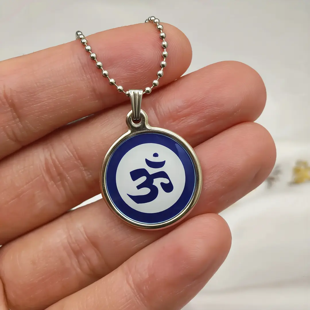 Blue Om Pendant hand-held detail view