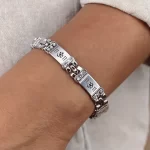 Crystal Om Silver Bracelet worn on a men's wrist