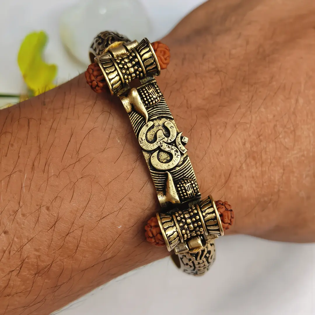 Gold Plated Shivlinga Om Trishul Rudraksha Bracelet worn on a men's wrist