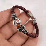 Lord Shiva Mahakal Leather Bracelet held in hand close-up