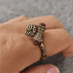 Mahakal Rudraksha Rose Gold Plated Ring worn on a men's finger