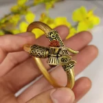 Om Damru Rudraksha Bracelet held in hand close-up
