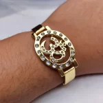 Om Gold Plated Beaded Bracelet worn on a men's wrist