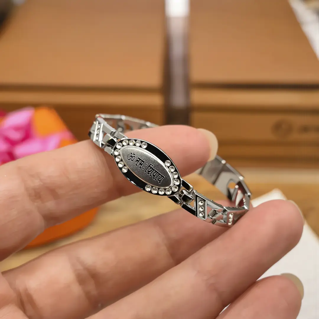 Silver Om Namah Shivay Diamond Bracelet held in hand close-up