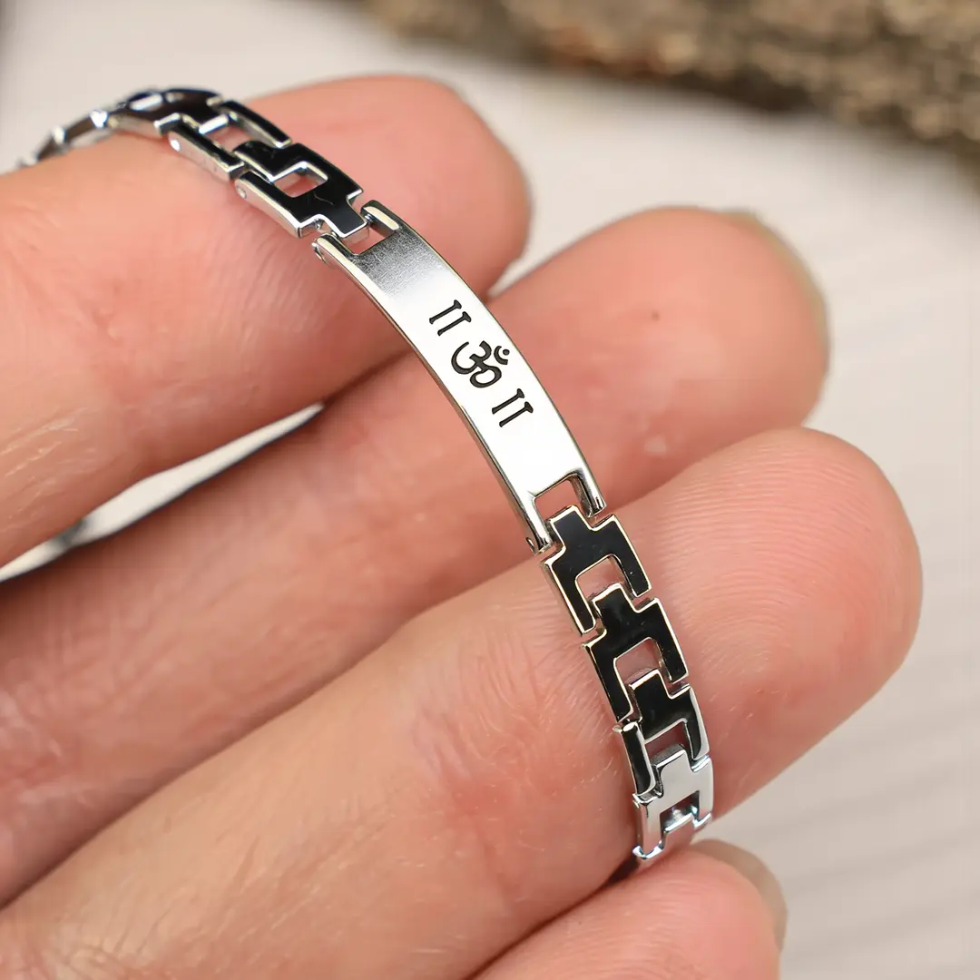 Om Silver Steel Bracelet hand-held detail view