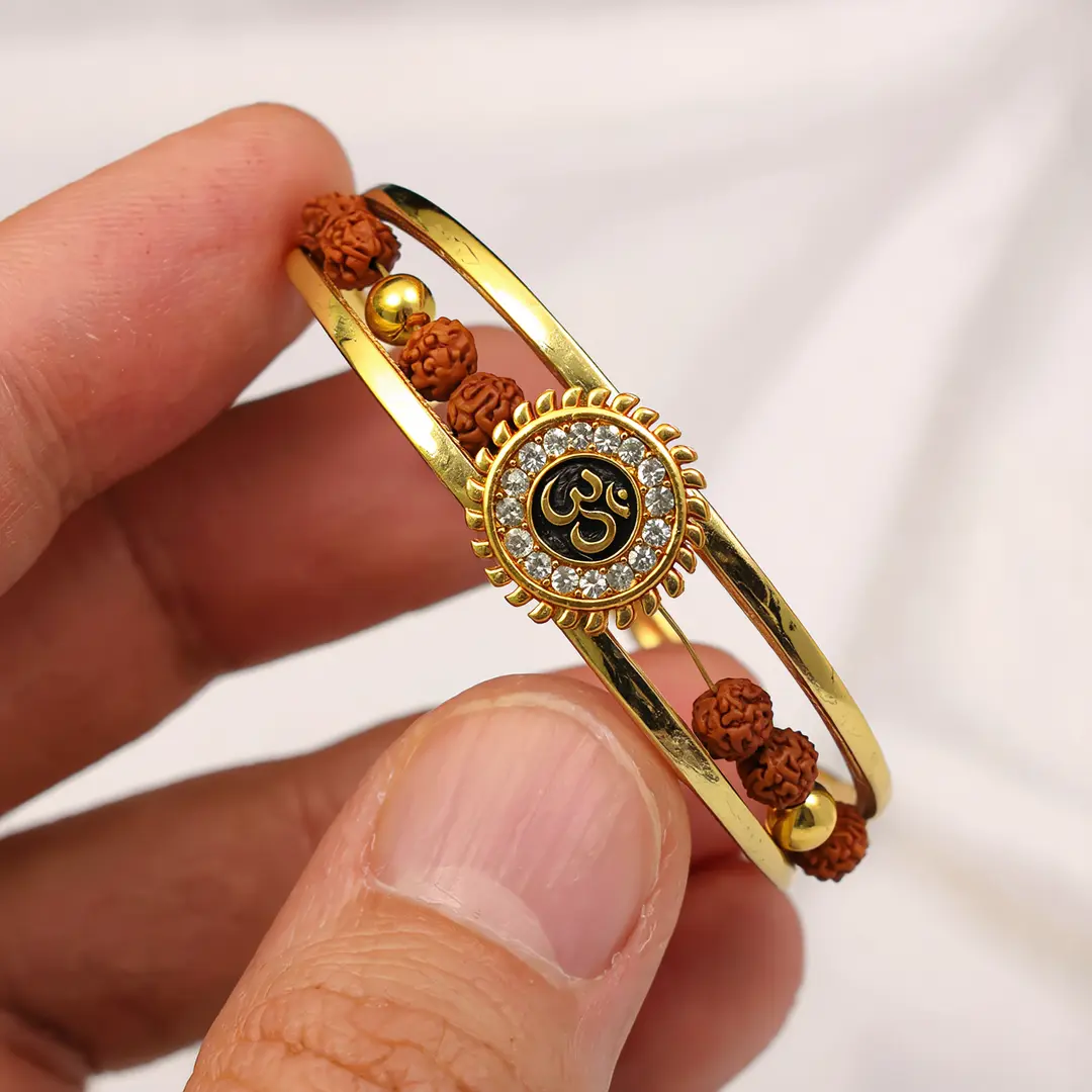 Om Sun Cuff Kada Bracelet with Rudraksh and Crystal for Men held in hand close-up