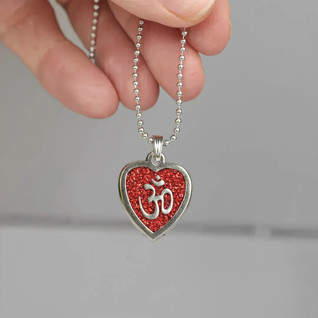 Red Om Heart Pendant hand-held detail view