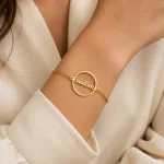 Round Name Bracelet on female wrist – personalized jewellery