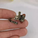 Shiv Rudraksha Rose Gold Plated Ring held in hand close-up