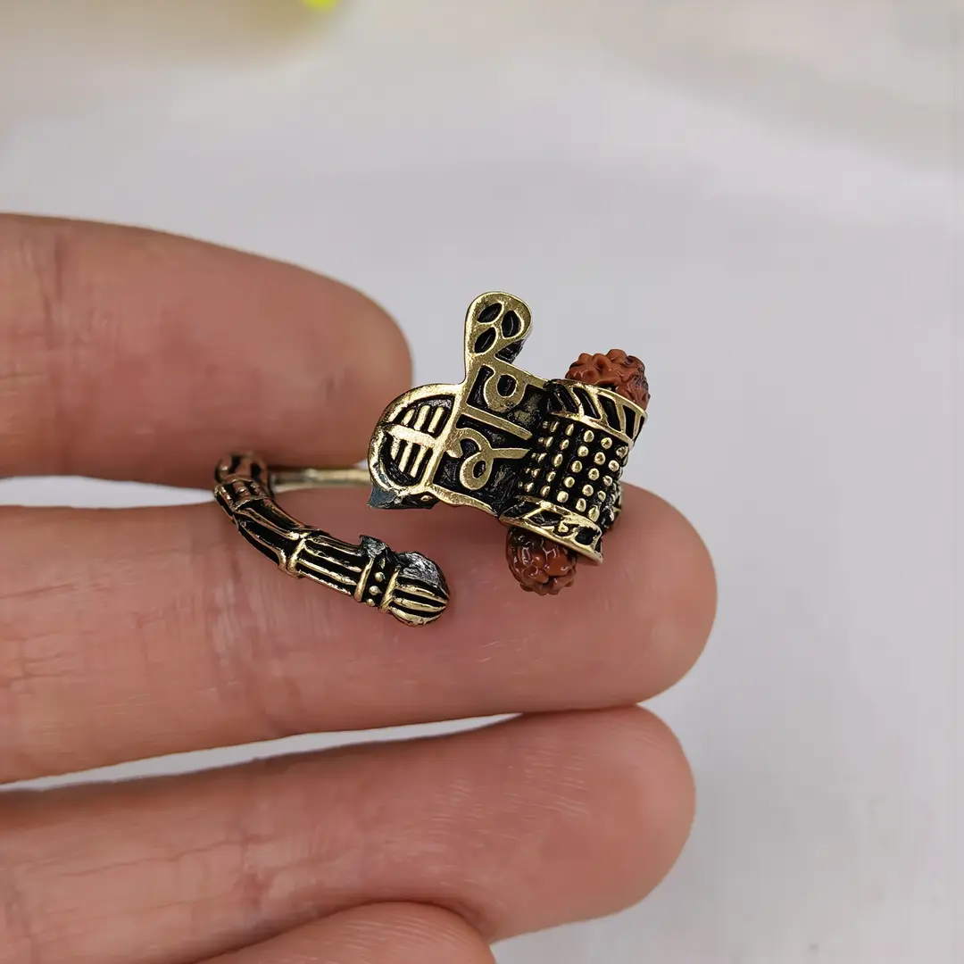 Shiv Rudraksha Rose Gold Plated Ring โ hand Shiv Rudraksha Rose Gold Plated Ring held in hand close-up