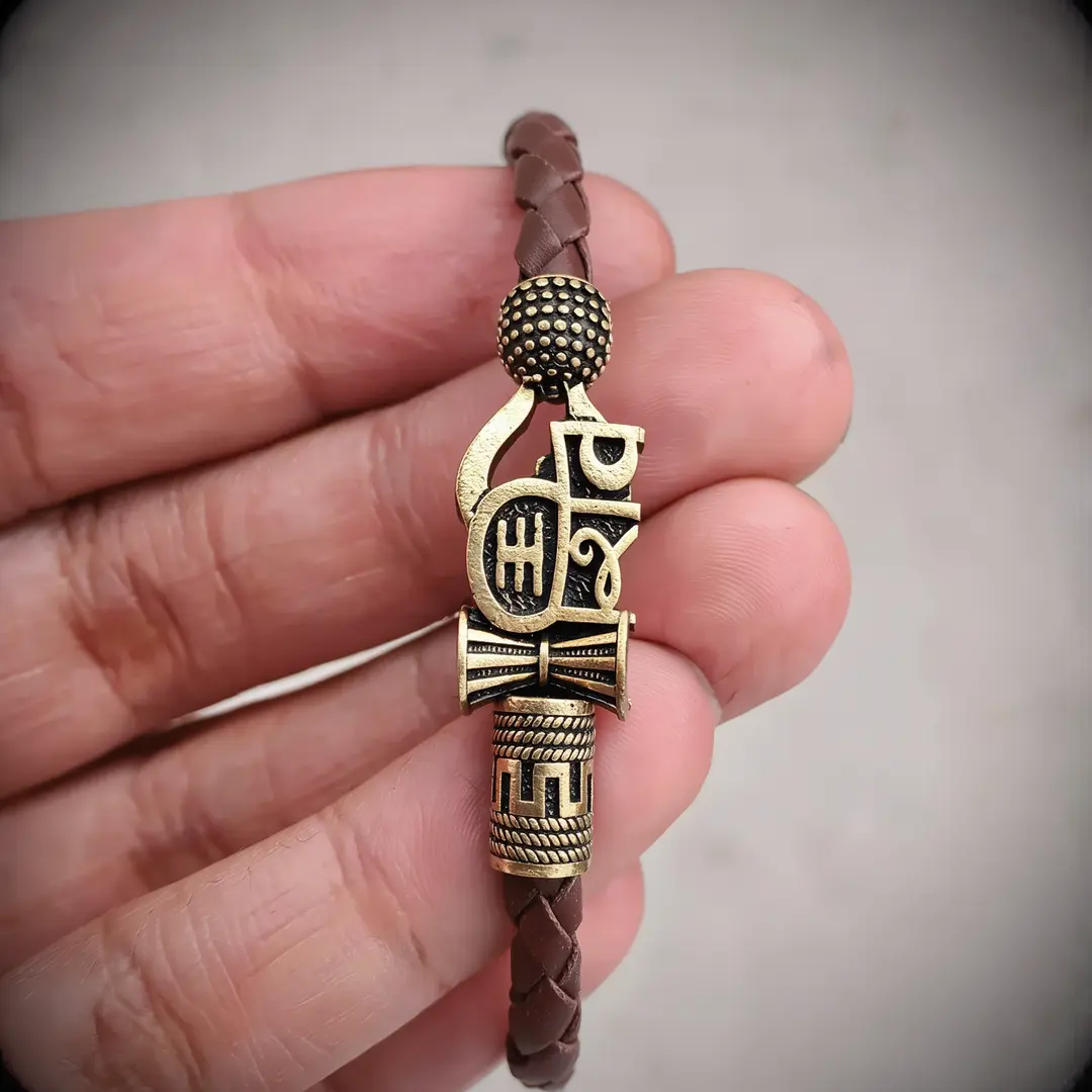 Shiva Damru Bracelet For Men held in hand close-up