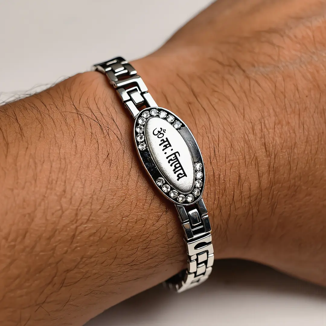 Silver-Plated Oval Om Namah Shivay Bracelet worn on a men's wrist