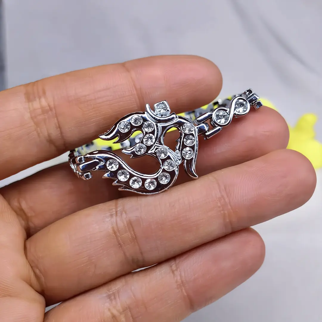 Silver Plated Om Diamond Bracelet held in hand close-up