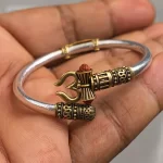 Trendy One Sided Trishul Damru OM Rudraksha Beads Gold Plated Kada held in hand close-up