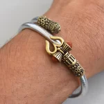 Trendy One Sided Trishul Damru OM Rudraksha Beads Gold Plated Kada worn on a men's wrist